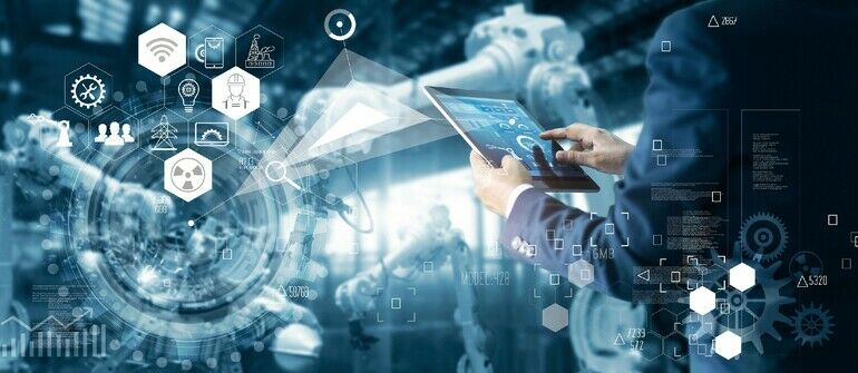 _Manager_Technicial_Industrial_Engineer_working_and_control_roboticts_with_monitoring_system_software_and_icon_industry_network_connection_on_tablet._AI,_Artificial_Intelligence,_Automation_robot_arm_machine_in_smart_factory_on_blue_digital_background,_In