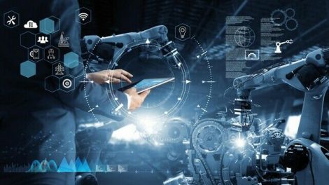 Manager_Technical_Industrial_Engineer_working_and_control_robotics_with_monitoring_system_software_and_icon_industry_network_connection_on_tablet._AI,_Artificial_Intelligence,_Automation_robot_arm