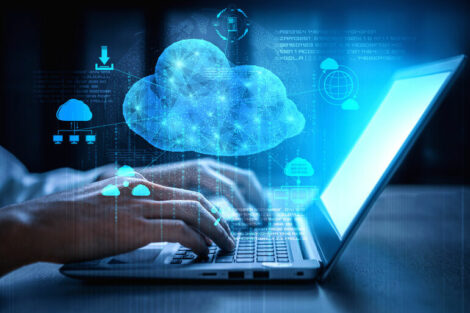Cloud_computing_technology_and_online_data_storage_for_business_network_concept._Computer_connects_to_internet_server_service_for_cloud_data_transfer_presented_in_3D_futuristic_graphic_interface.