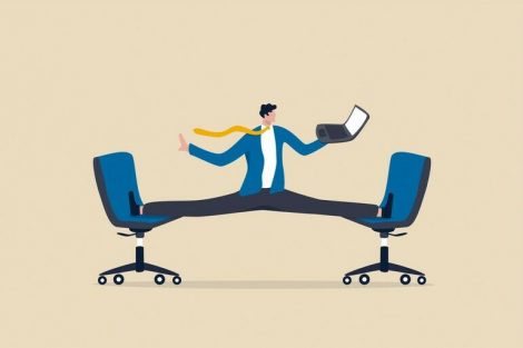 Flexible_work,_let_employee_manage_their_working_time_to_finish_project_concept,_smart_relax_businessman_working_with_laptop_computer_stretching_his_leg_between_chairs_balance_like_yoga.