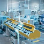 Futuristic_Design:_Factory_Digitalization_with_Information_Lines_Lying_Through_the_High-Tech_Modern_Electronics_Facility._CNC_Automatic_Machinery_Manufacturing_Products_Using_IoT_Industry_4.0