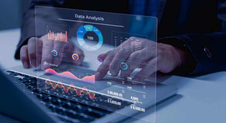 Business_development_and_technology_Data_analyst_for_report_marketing_strategy_planning._graph_analysis_and_information_on_a_futuristic_virtual_interface_screen.