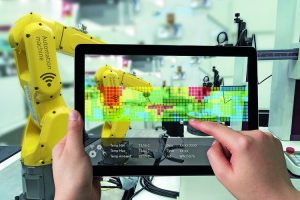 Industry_4.0_concept_.Man_hand_holding_tablet_with_Augmented_reality_screen_software_and_blue_tone_of_automate_wireless_Robot_arm_in_smart_factory_background