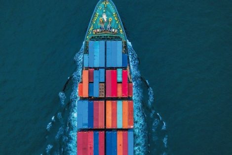 Aerial_view_container_ship_or_cargo_ship_in_import_export_and_business_logistic_to_global_city.