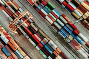 Aerial_view_of_shipping_container_port_terminal._Colourful_pattern_of_containers_in_harbor._Maritime_logistics_global_inport_export_trade_transportation