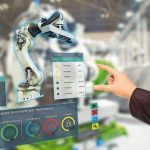 iot_industry_4.0_concept,industrial_engineer(blurred)_using_smart_glasses_with_augmented_mixed_with_virtual_reality_technology_to_monitoring_machine_in_real_time.Smart_factory_use_Automation_robot_arm