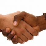 Black_and_white_hands_shaking_in_friendly_agreement_isoalted_on_white